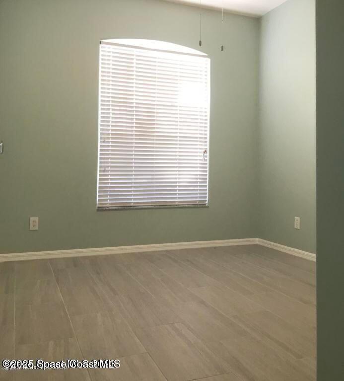 3121 Atocha Lane Indialantic, FL 32903 - Photo 13 of 17 a view of an empty room with a window