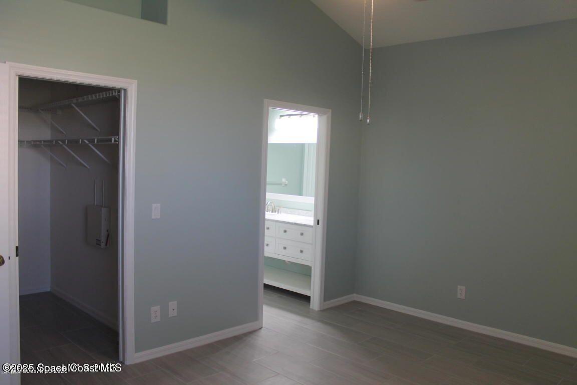 3121 Atocha Lane Indialantic, FL 32903 - Photo 10 of 17 a view of an empty room with closet and a window
