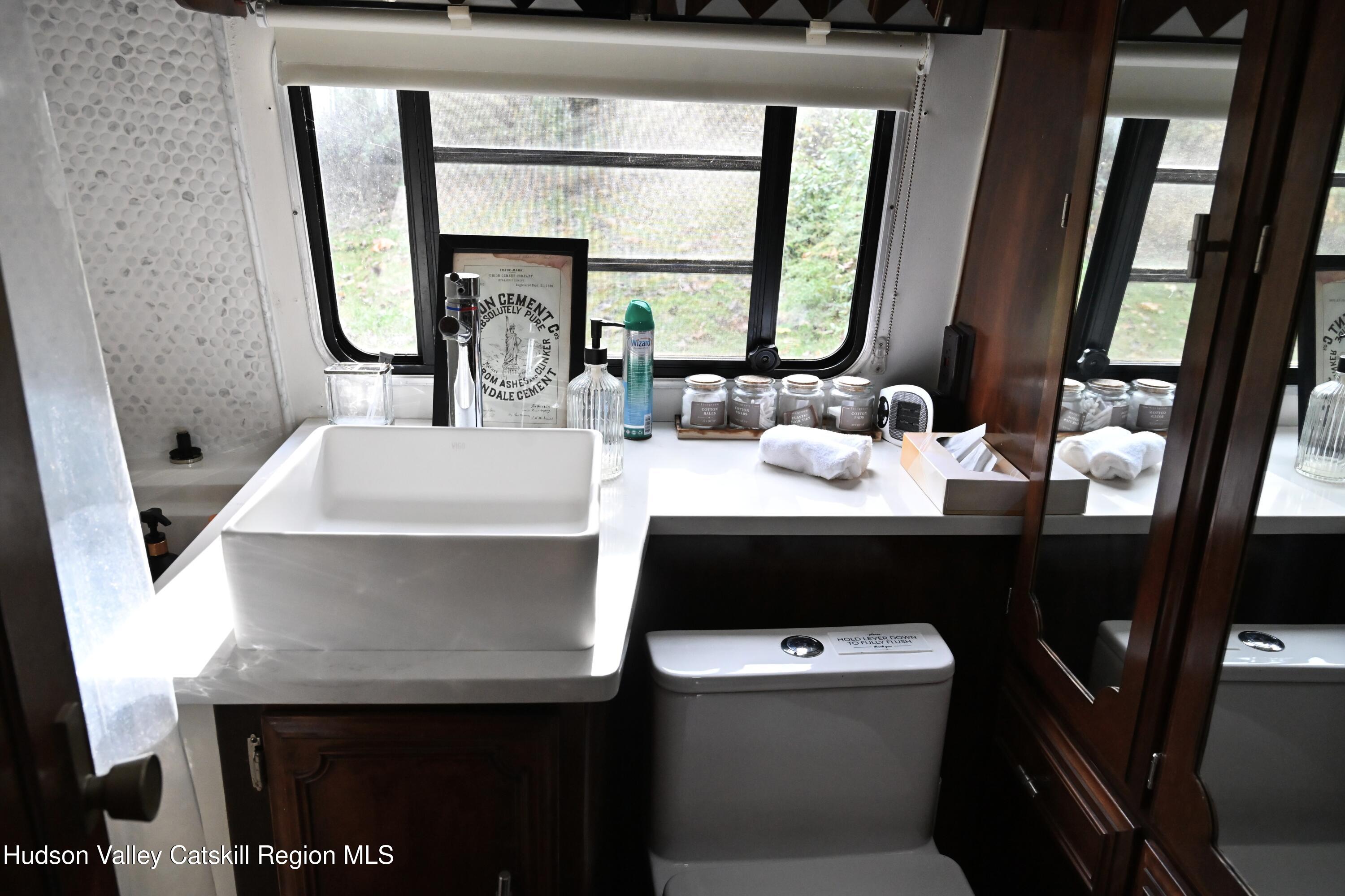 275 Creek Locks Road Rosendale, NY 12472 - Photo 11 of 23 a bathroom with a sink and a mirror