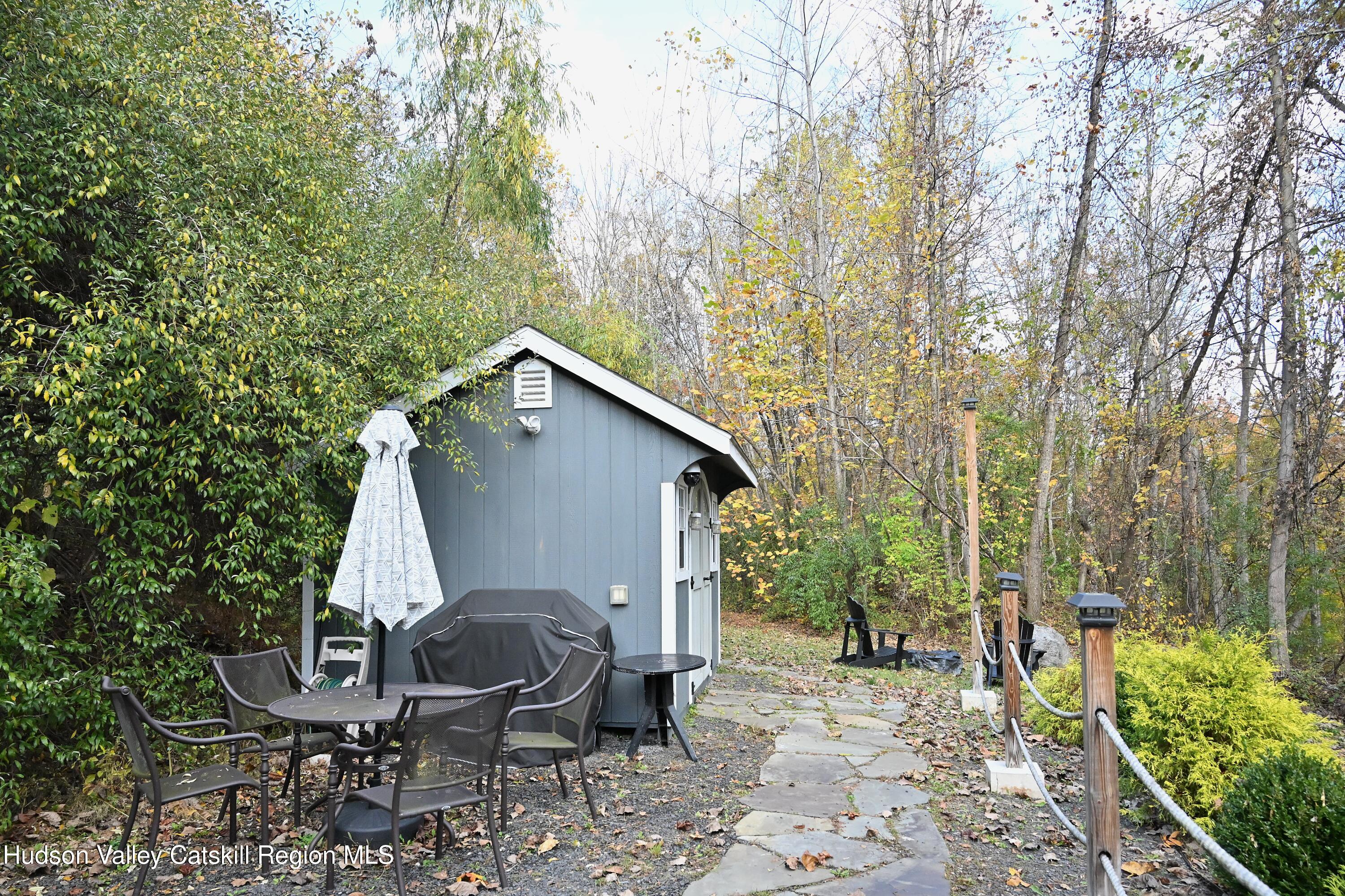 275 Creek Locks Road Rosendale, NY 12472 - Photo 12 of 23 a backyard of a house with seating space