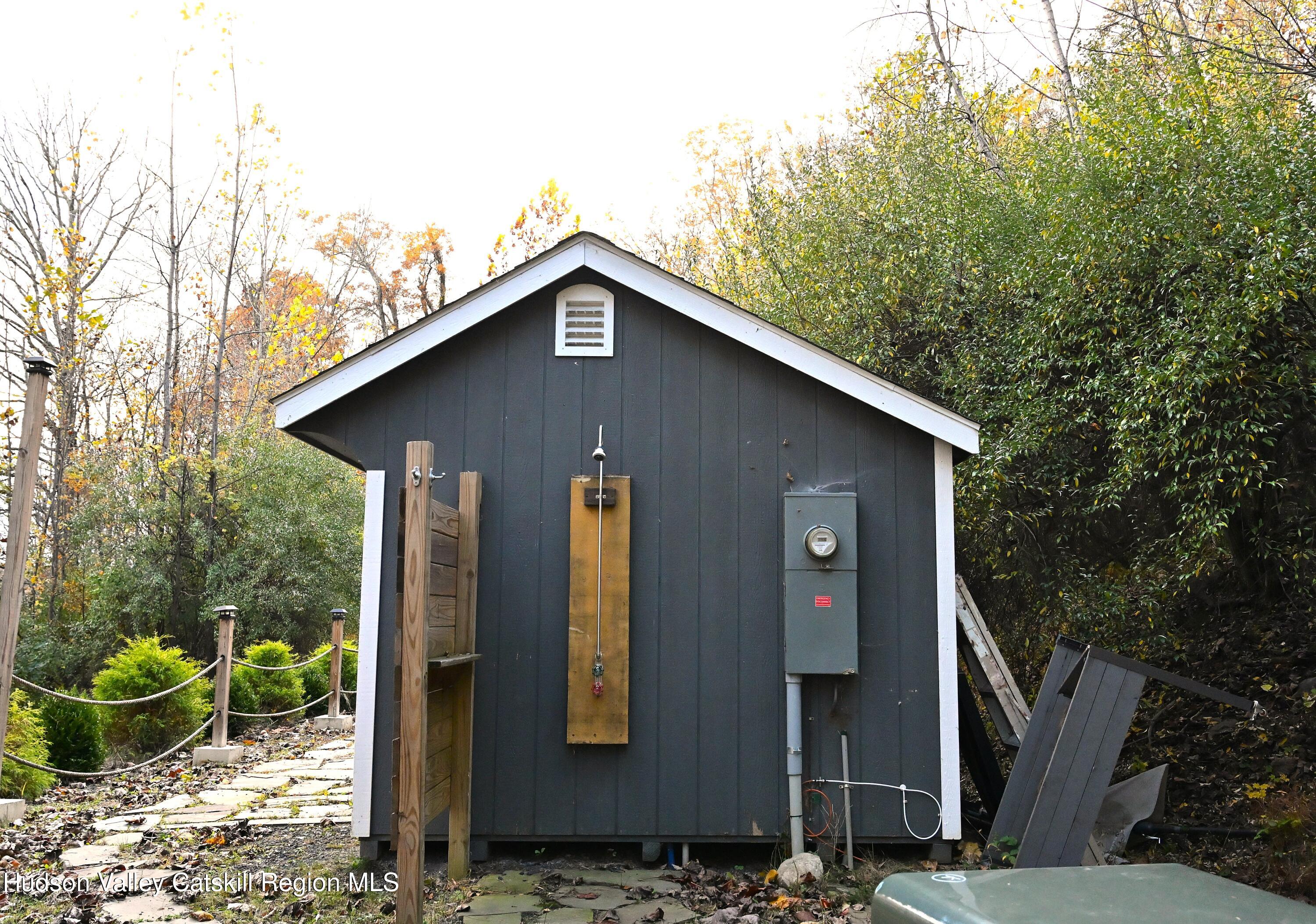 275 Creek Locks Road Rosendale, NY 12472 - Photo 13 of 23 a front view of a house with garden