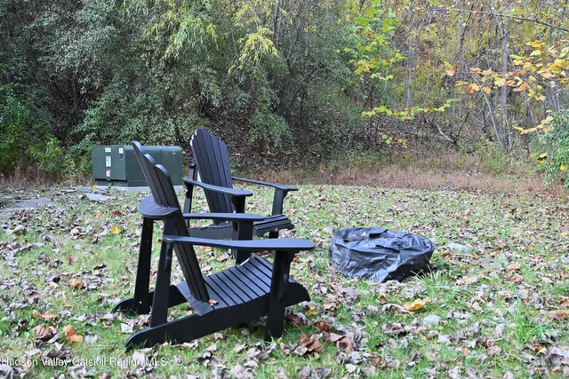 a view of a backyard with sitting area