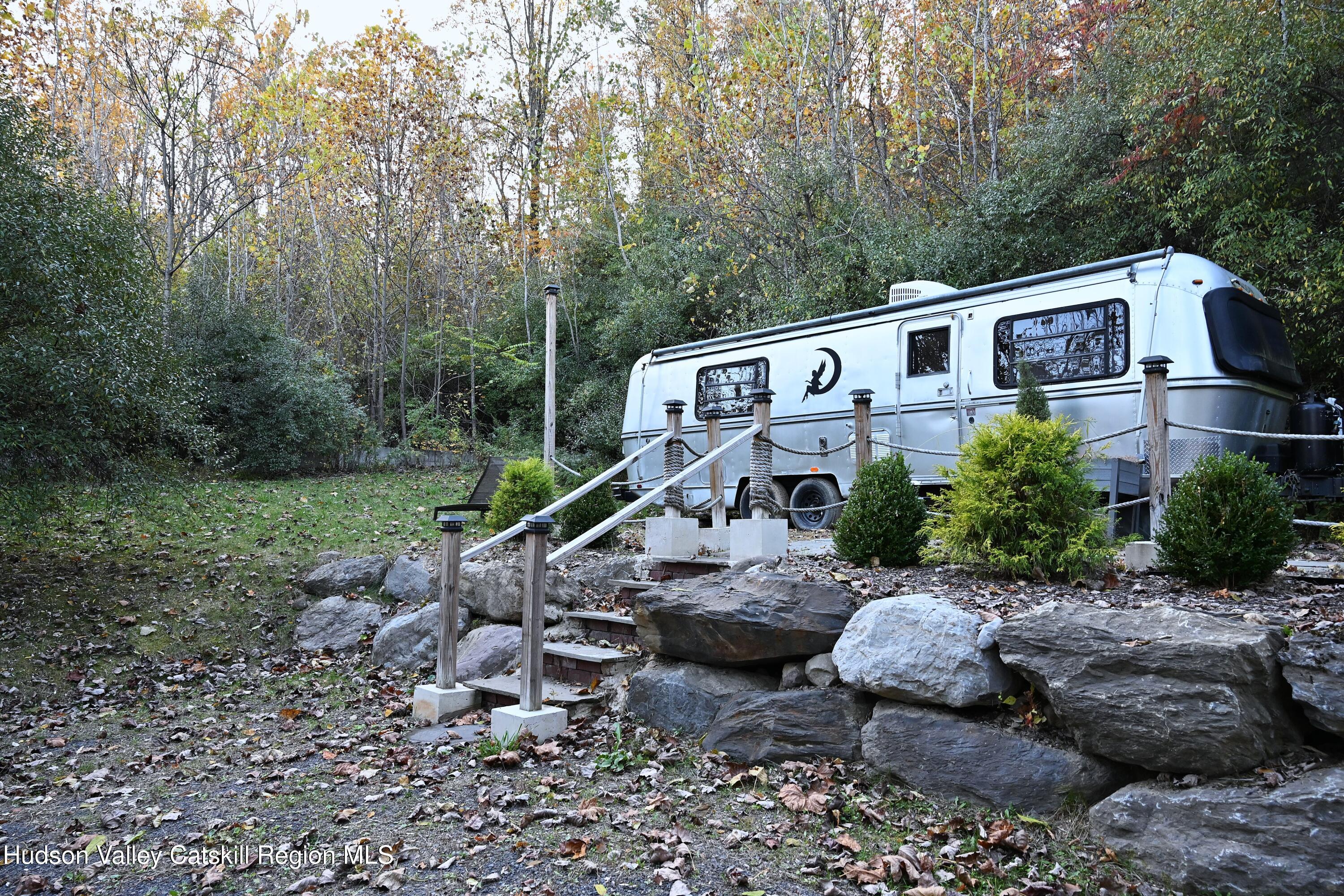 275 Creek Locks Road Rosendale, NY 12472 - Photo 6 of 23 a view of a house with a yard and furniture