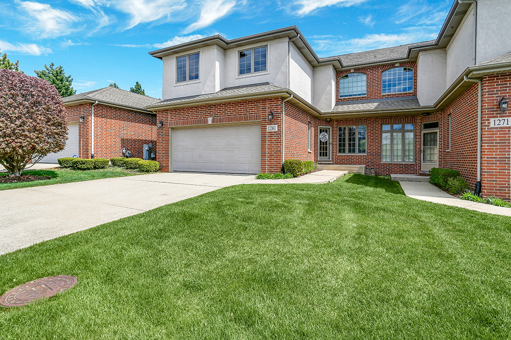 1261 Chestnut Crossing Lemont, IL 60439 - Photo 1 of 1 a front view of a house with a yard and garage