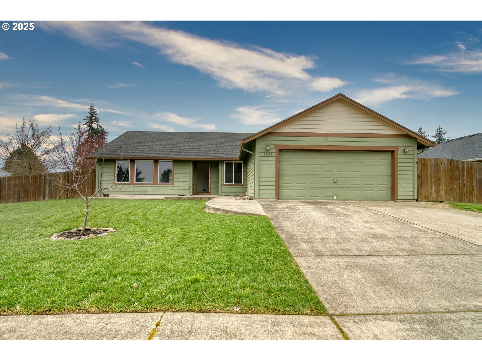 34122 Adison Street Scappoose, OR 97056 - Photo 1 of 41 a front view of a house with a yard