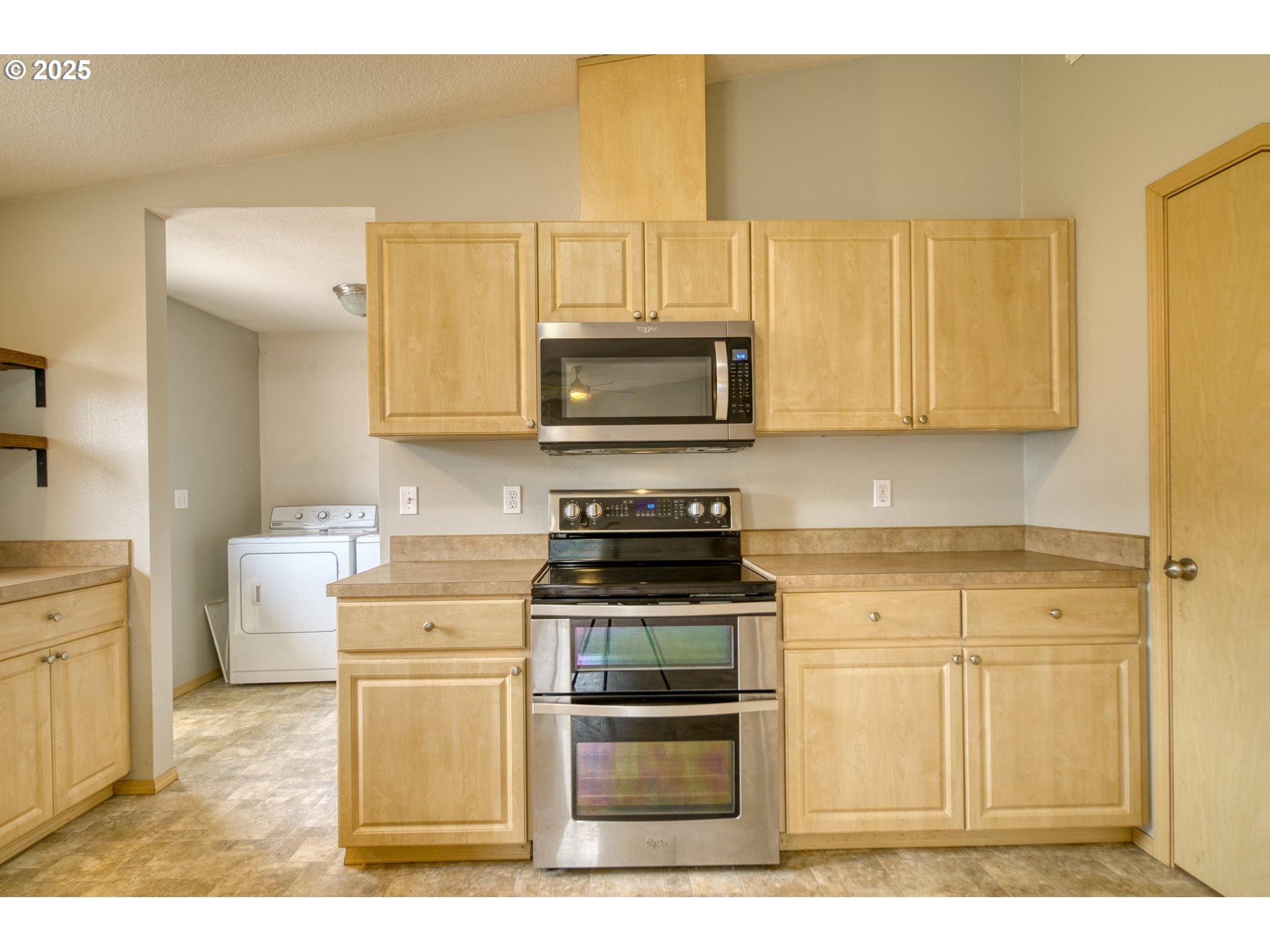 34122 Adison Street Scappoose, OR 97056 - Photo 13 of 41 a kitchen with a stove and a microwave