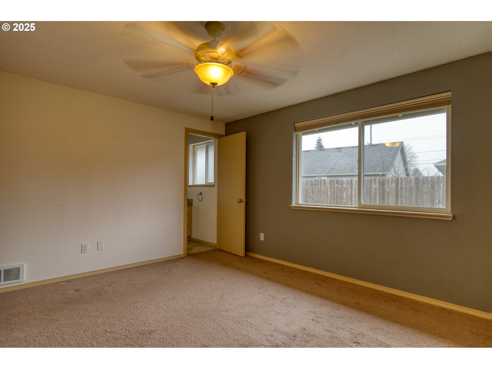 34122 Adison Street Scappoose, OR 97056 - Photo 16 of 41 a view of an empty room with a window
