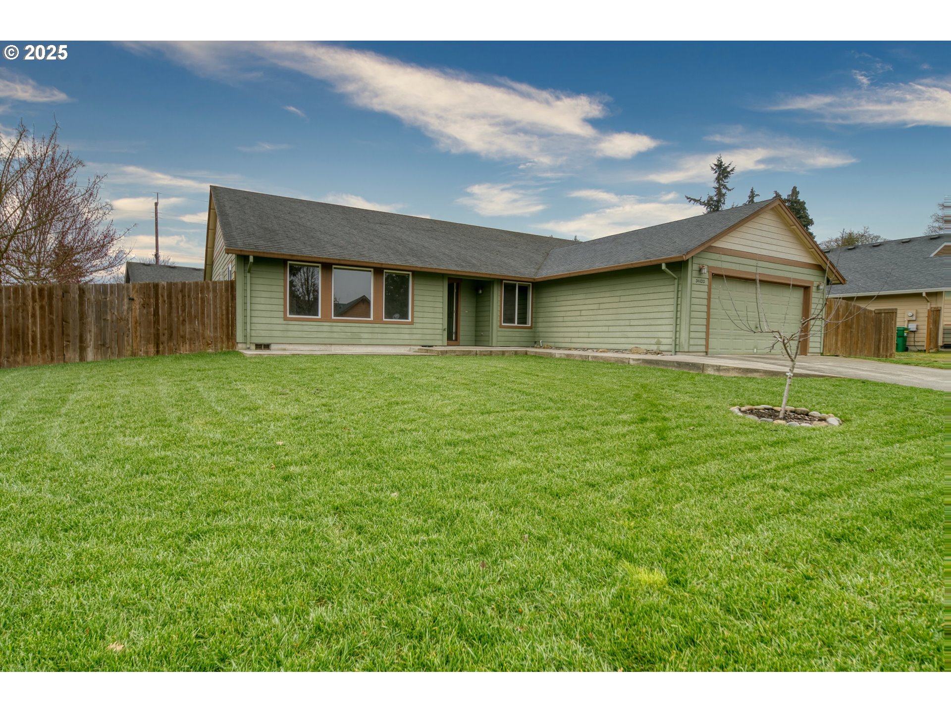34122 Adison Street Scappoose, OR 97056 - Photo 2 of 41 a front view of a house with a yard