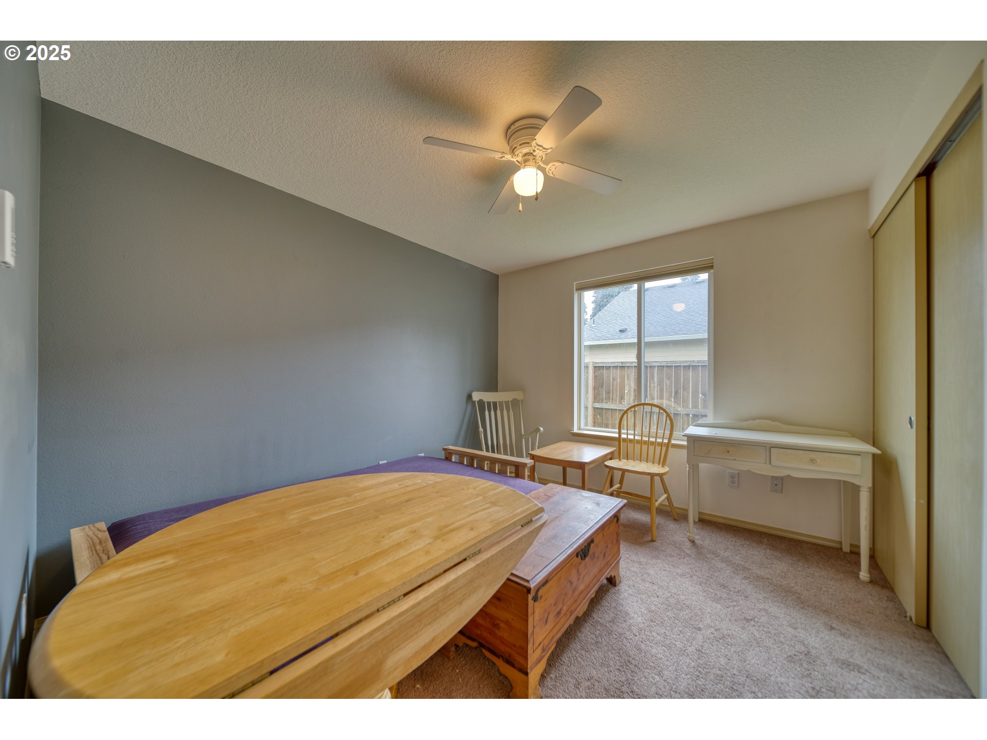 34122 Adison Street Scappoose, OR 97056 - Photo 22 of 41 a living room with a bed furniture and a window