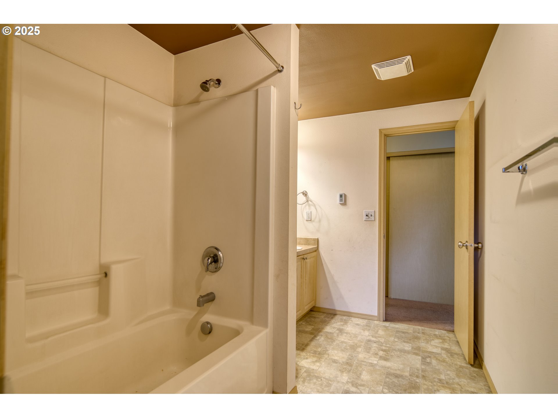 34122 Adison Street Scappoose, OR 97056 - Photo 27 of 41 a bathroom with a granite countertop sink a mirror and a bathtub