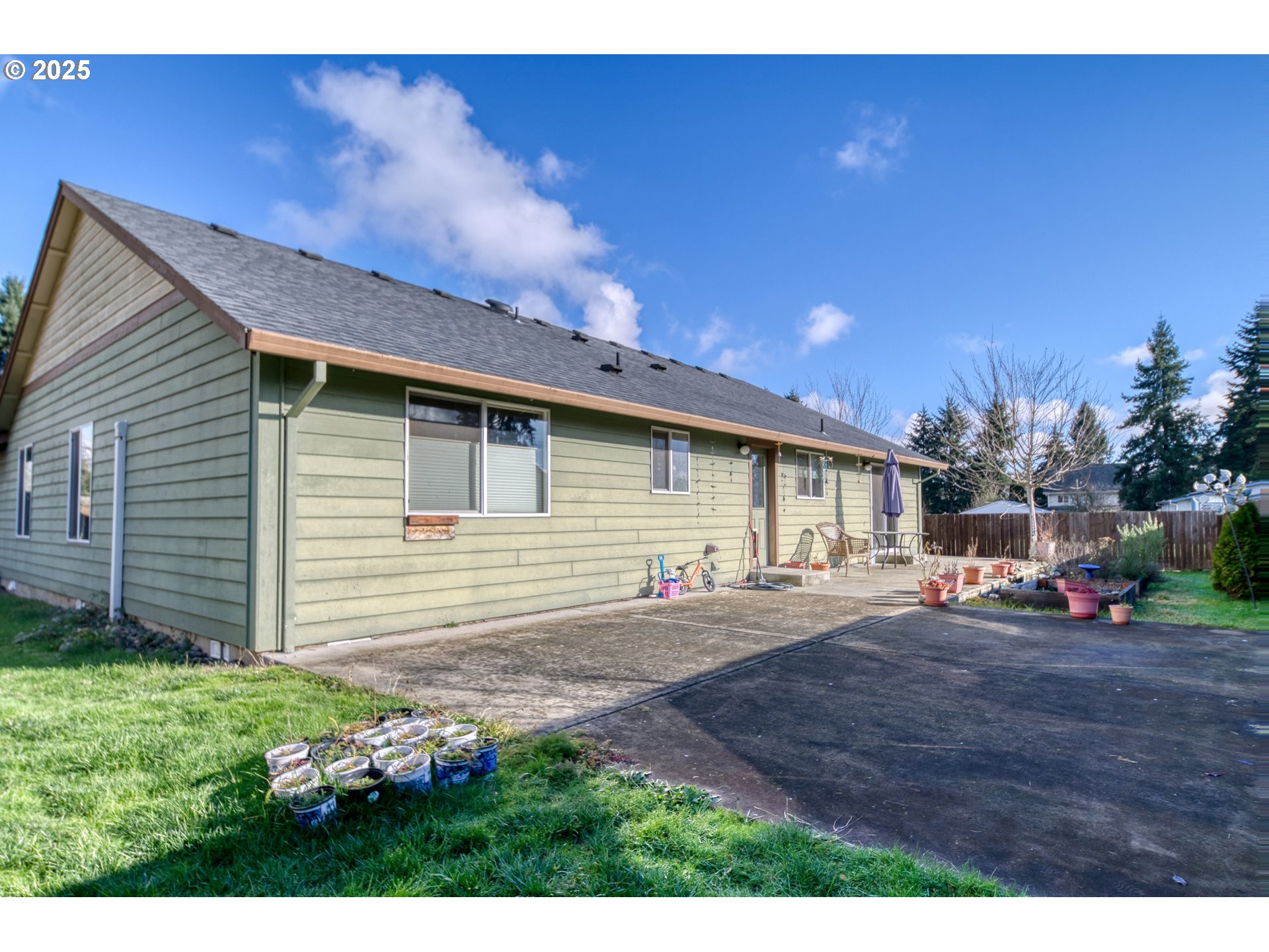 34122 Adison Street Scappoose, OR 97056 - Photo 35 of 41 a front view of a house with a garden
