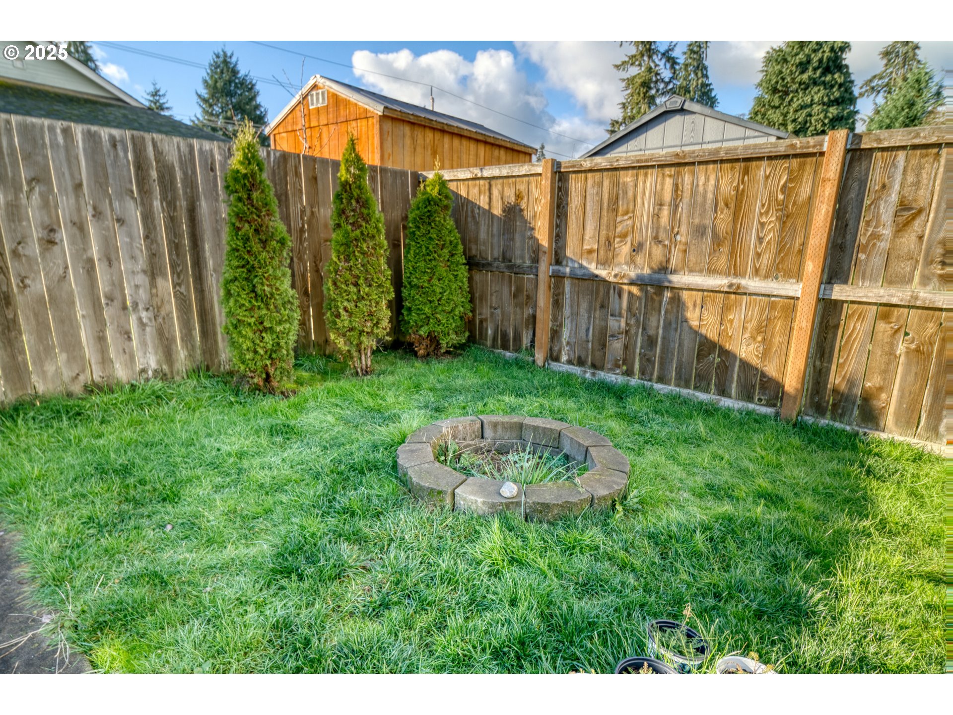 34122 Adison Street Scappoose, OR 97056 - Photo 36 of 41 a view of a backyard with a garden
