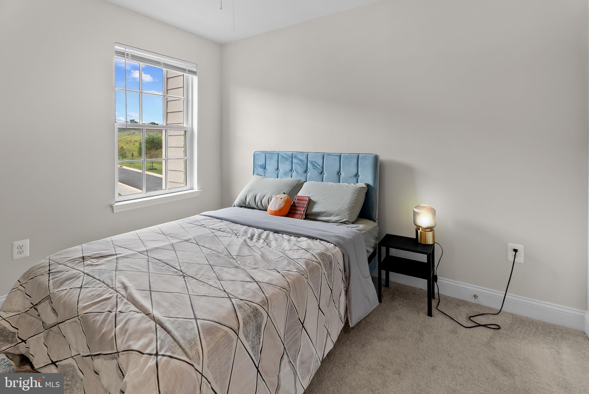 7202 Conley Alley Sykesville, MD 21784 - Photo 12 of 24 a bedroom with a bed and window
