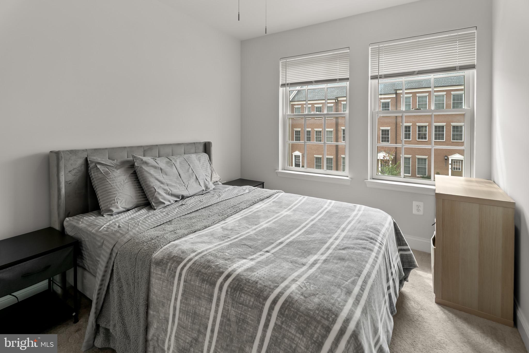 7202 Conley Alley Sykesville, MD 21784 - Photo 14 of 24 a large bed sitting in a bedroom next to a window