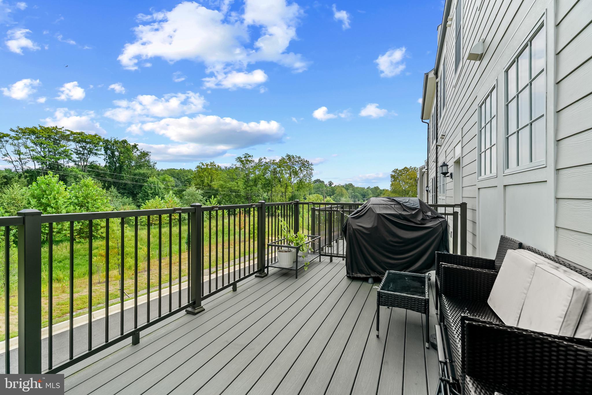 7202 Conley Alley Sykesville, MD 21784 - Photo 18 of 24 a view of balcony with chairs and wooden fence
