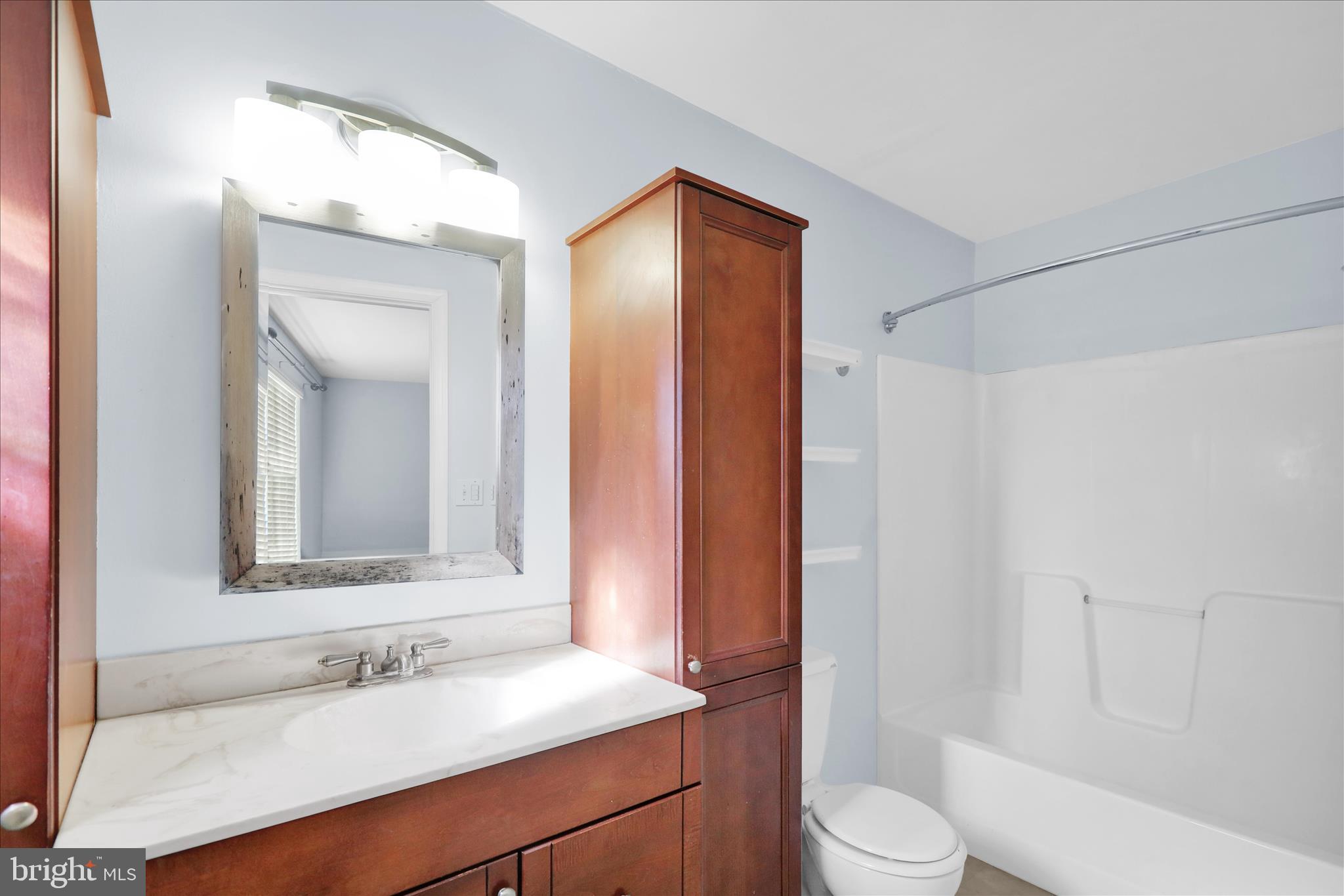 18 Bowes Lane Reading, PA 19606 - Photo 19 of 34 a bathroom with a sink toilet and shower