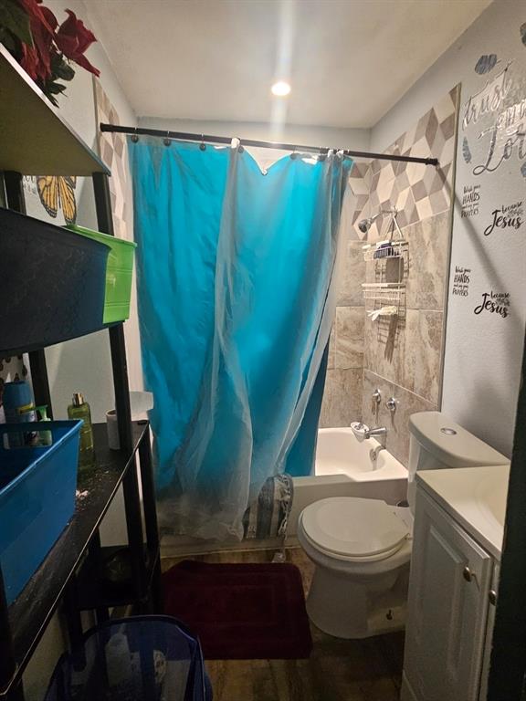 3500 Baylor Street Fort Worth, TX 76119 - Photo 11 of 16 a bathroom with a toilet a sink and tub