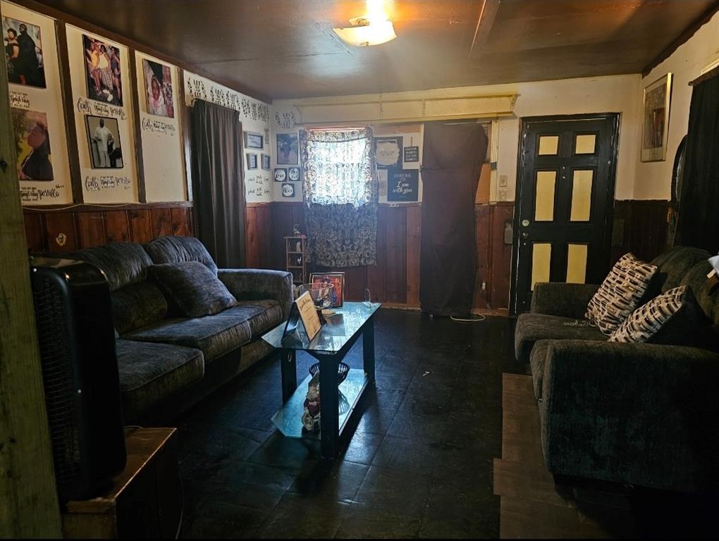 3500 Baylor Street Fort Worth, TX 76119 - Photo 5 of 16 a living room with furniture and a book shelf