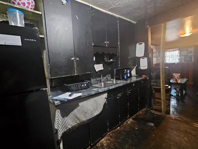 a bathroom with a granite countertop sink a vanity and a mirror
