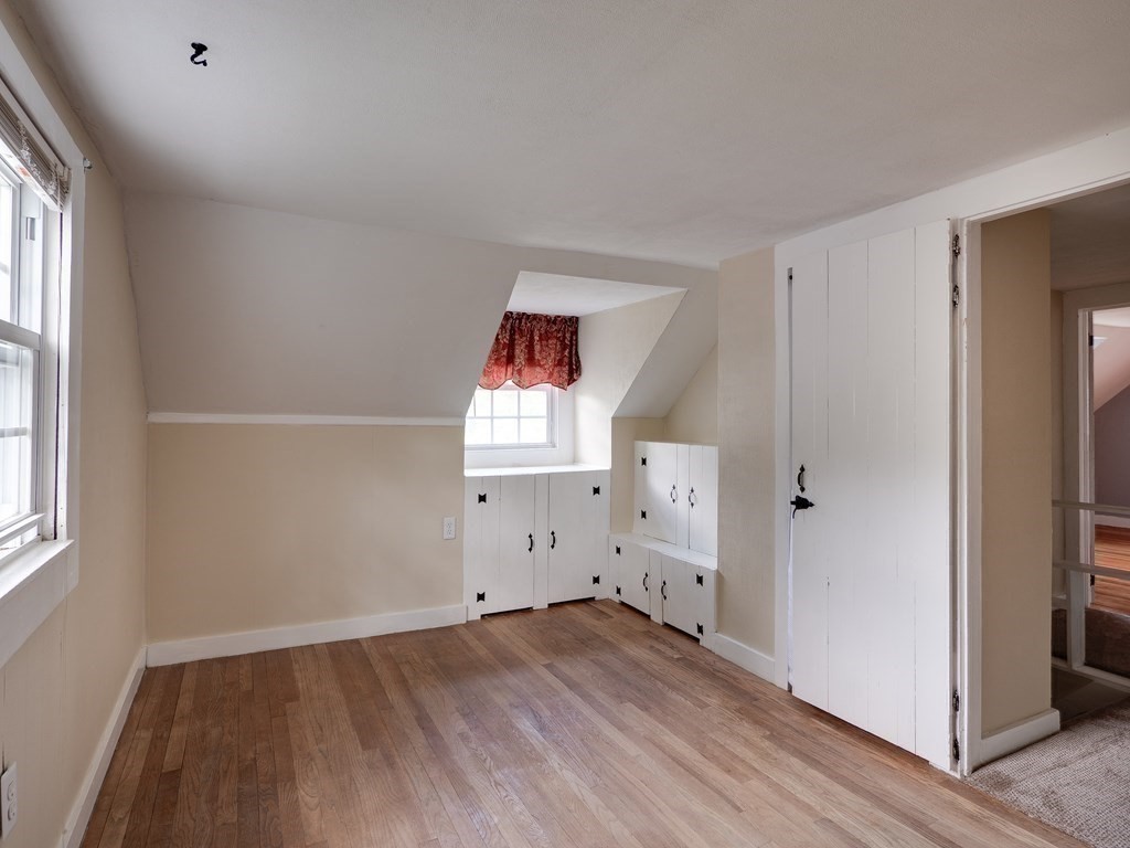 357 Massachusetts Avenue West Springfield, MA 01089 - Photo 12 of 22 an empty room with wooden floor and window