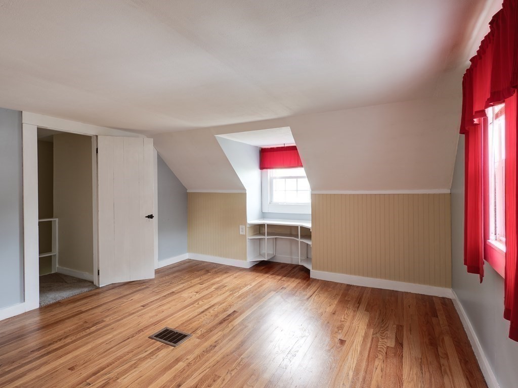 357 Massachusetts Avenue West Springfield, MA 01089 - Photo 14 of 22 an empty room with wooden floor and windows