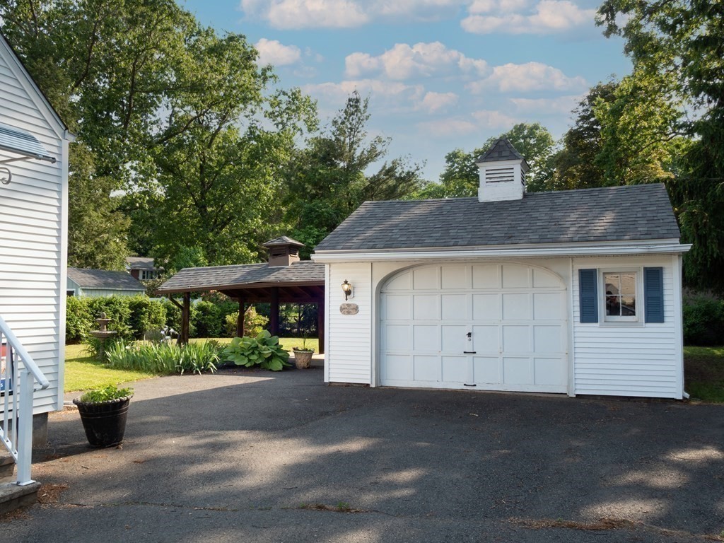 357 Massachusetts Avenue West Springfield, MA 01089 - Photo 17 of 22 a view of a house with a garden