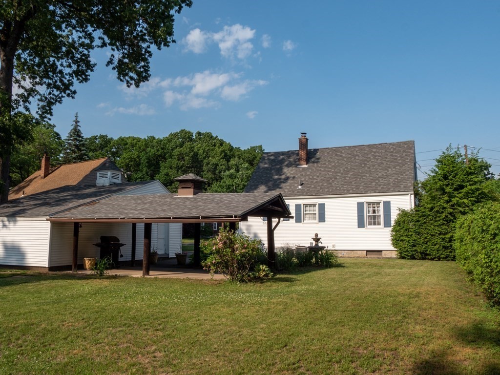 357 Massachusetts Avenue West Springfield, MA 01089 - Photo 2 of 22 a front view of a house with a garden