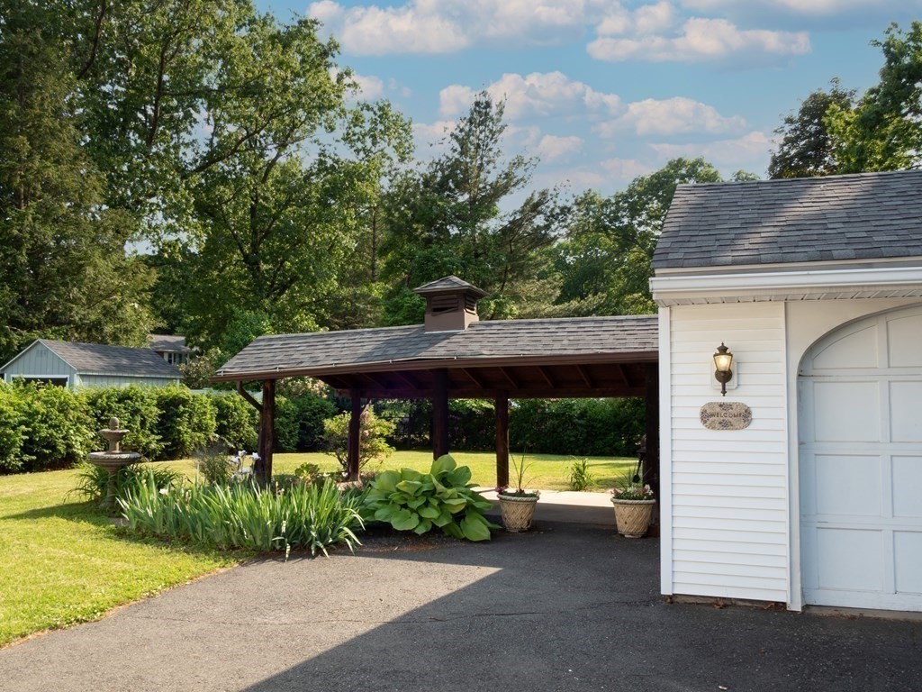 357 Massachusetts Avenue West Springfield, MA 01089 - Photo 21 of 22 a view of a patio with a table and chairs under an umbrella