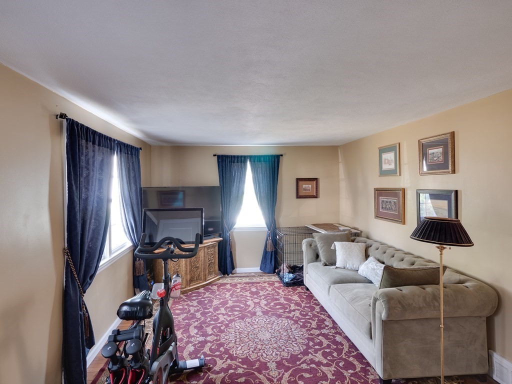 357 Massachusetts Avenue West Springfield, MA 01089 - Photo 9 of 22 a living room with furniture a lamp and a window