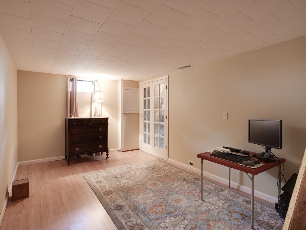 357 Massachusetts Avenue West Springfield, MA 01089 - Photo 10 of 22 a living room with a piano and a flat screen tv