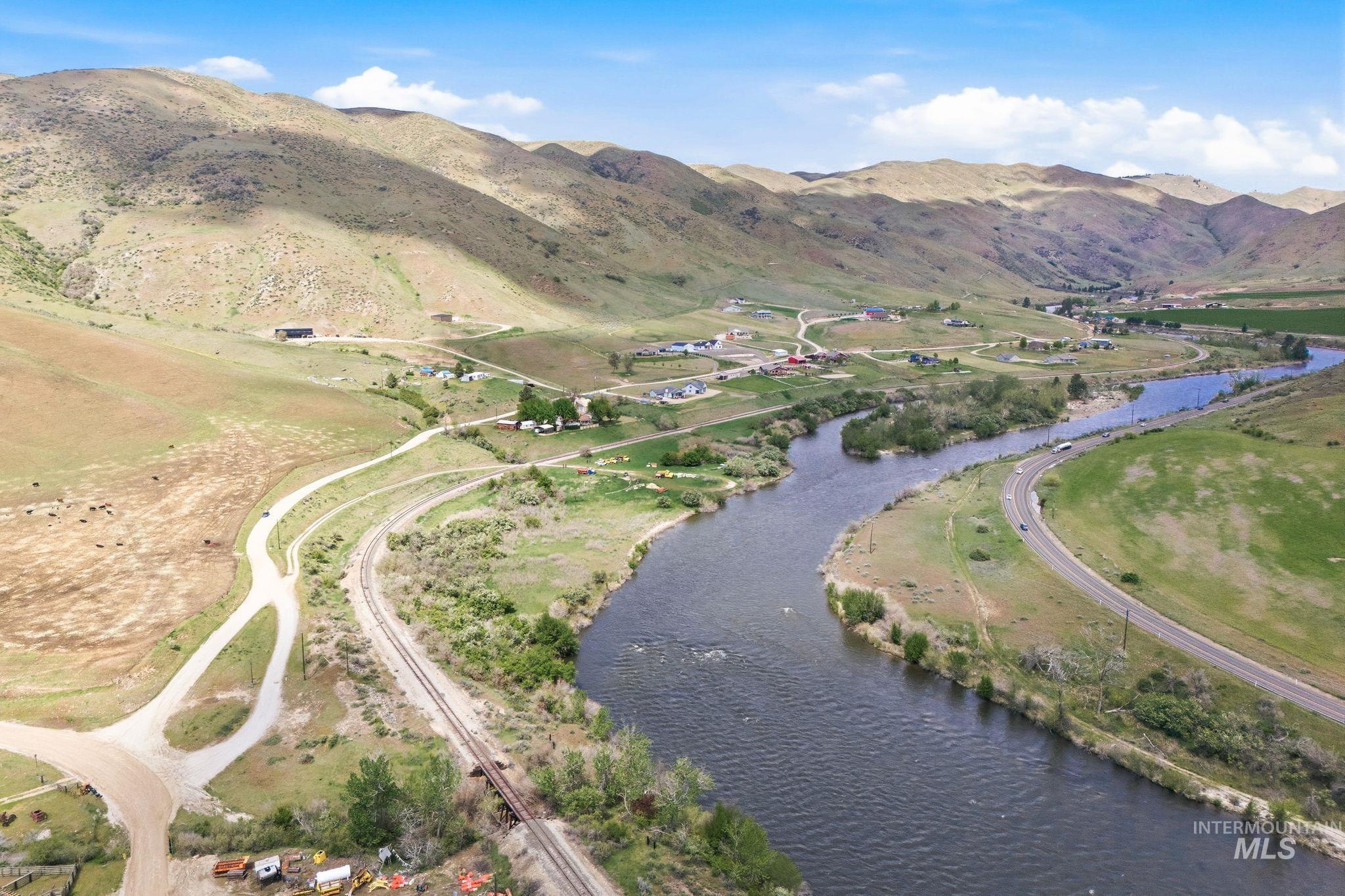 25 River Ridge Horseshoe Bend, ID 83629 - Photo 13 of 50 Expansive rural landscape featuring a winding river, verdant hillsides, and distant agricultural fields
