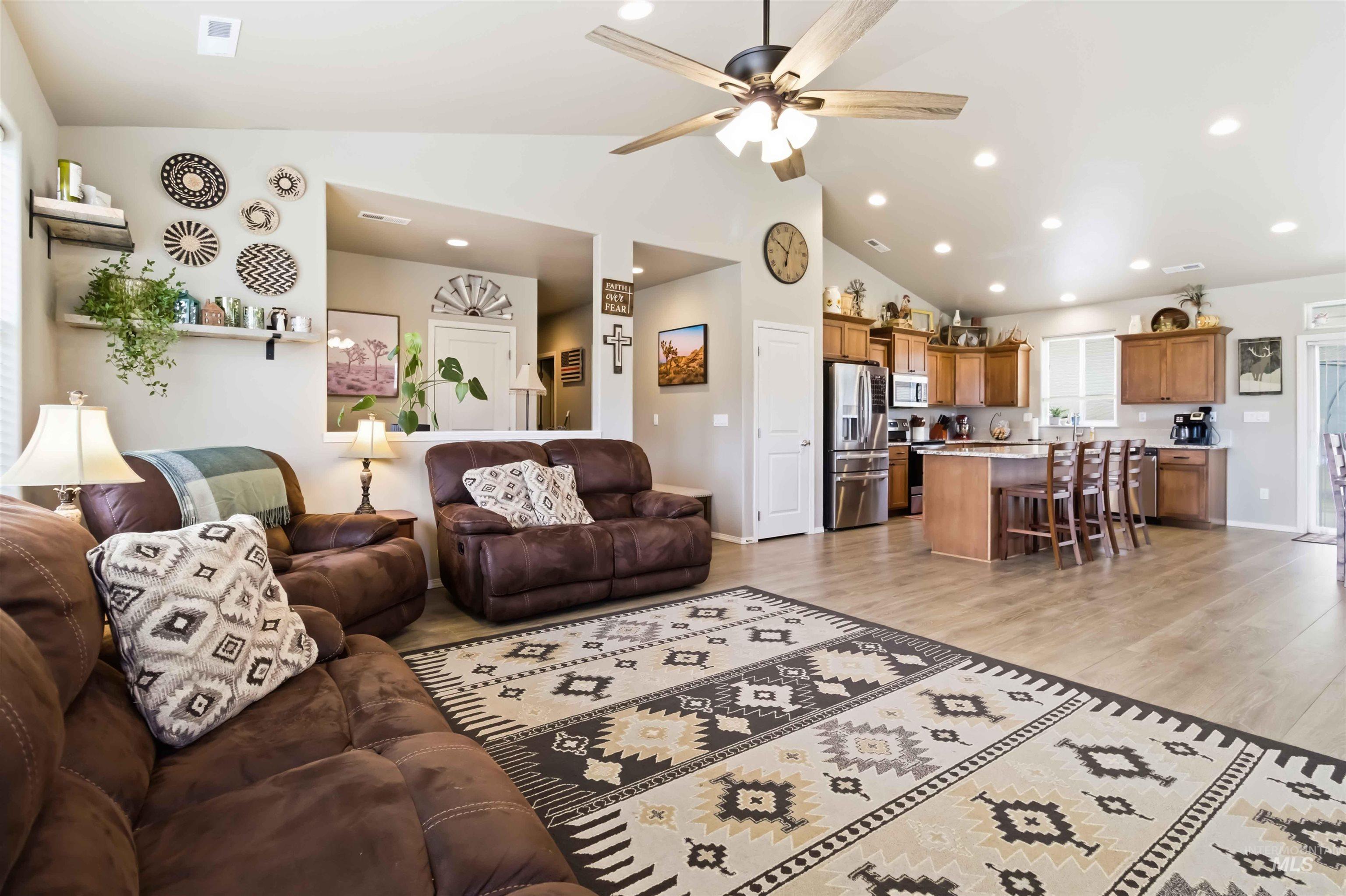 25 River Ridge Horseshoe Bend, ID 83629 - Photo 19 of 50 Living room featuring light wood-style floors, ceiling fan, lofted ceiling, and recessed lighting