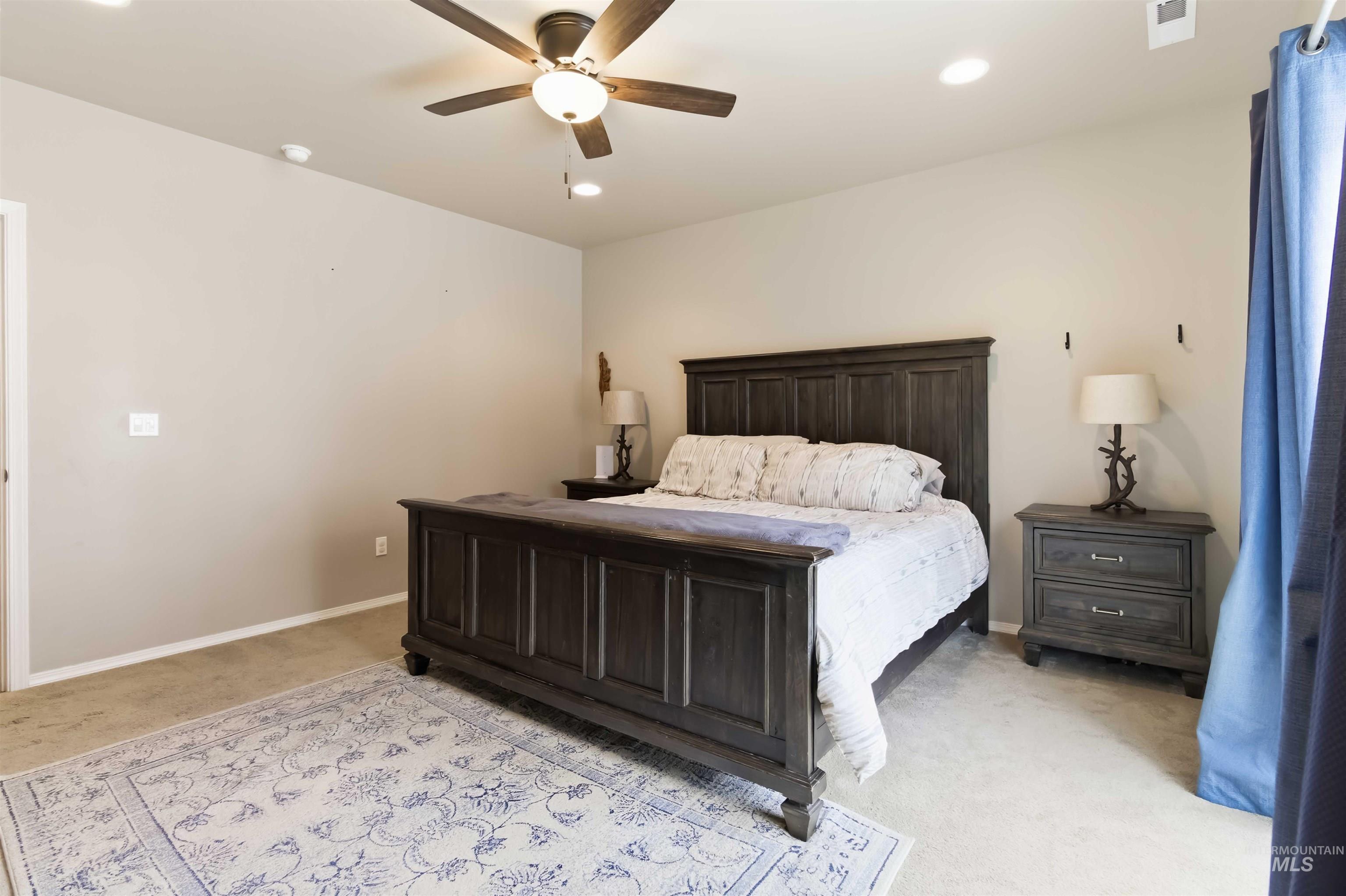 25 River Ridge Horseshoe Bend, ID 83629 - Photo 26 of 50 Bedroom with recessed lighting, a ceiling fan, and light carpet