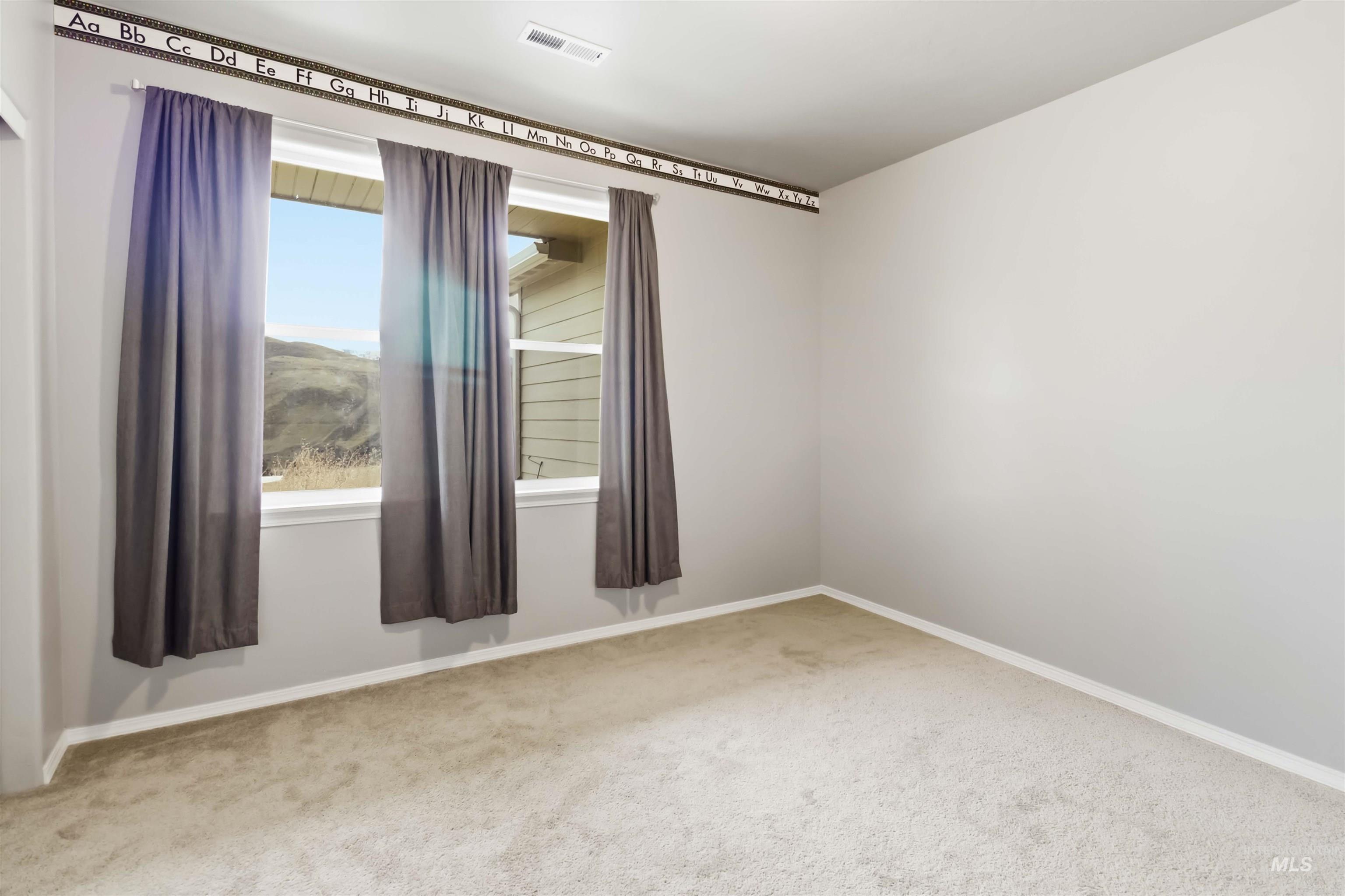 25 River Ridge Horseshoe Bend, ID 83629 - Photo 29 of 50 Empty room featuring light carpet and baseboards