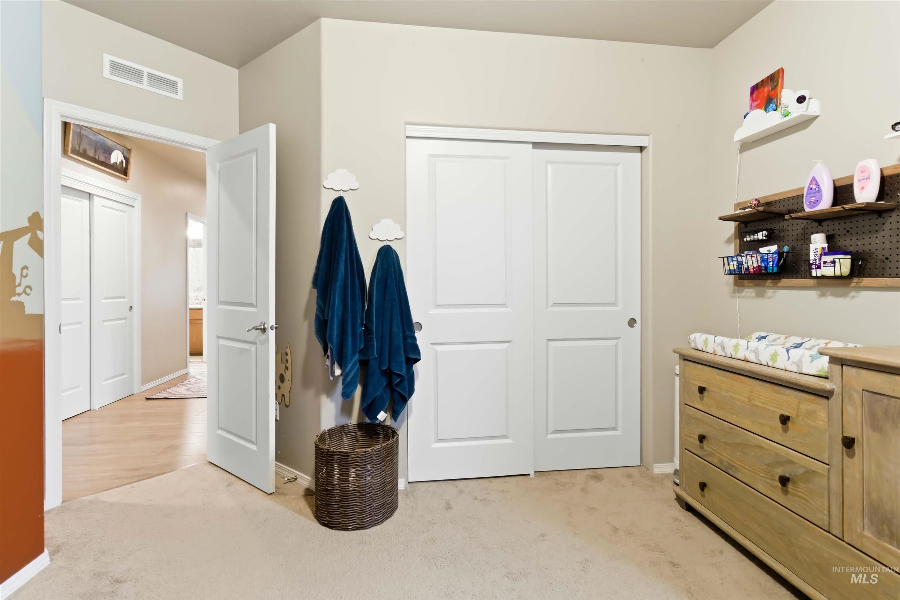 25 River Ridge Horseshoe Bend, ID 83629 - Photo 34 of 50 Bedroom with light carpet and a closet