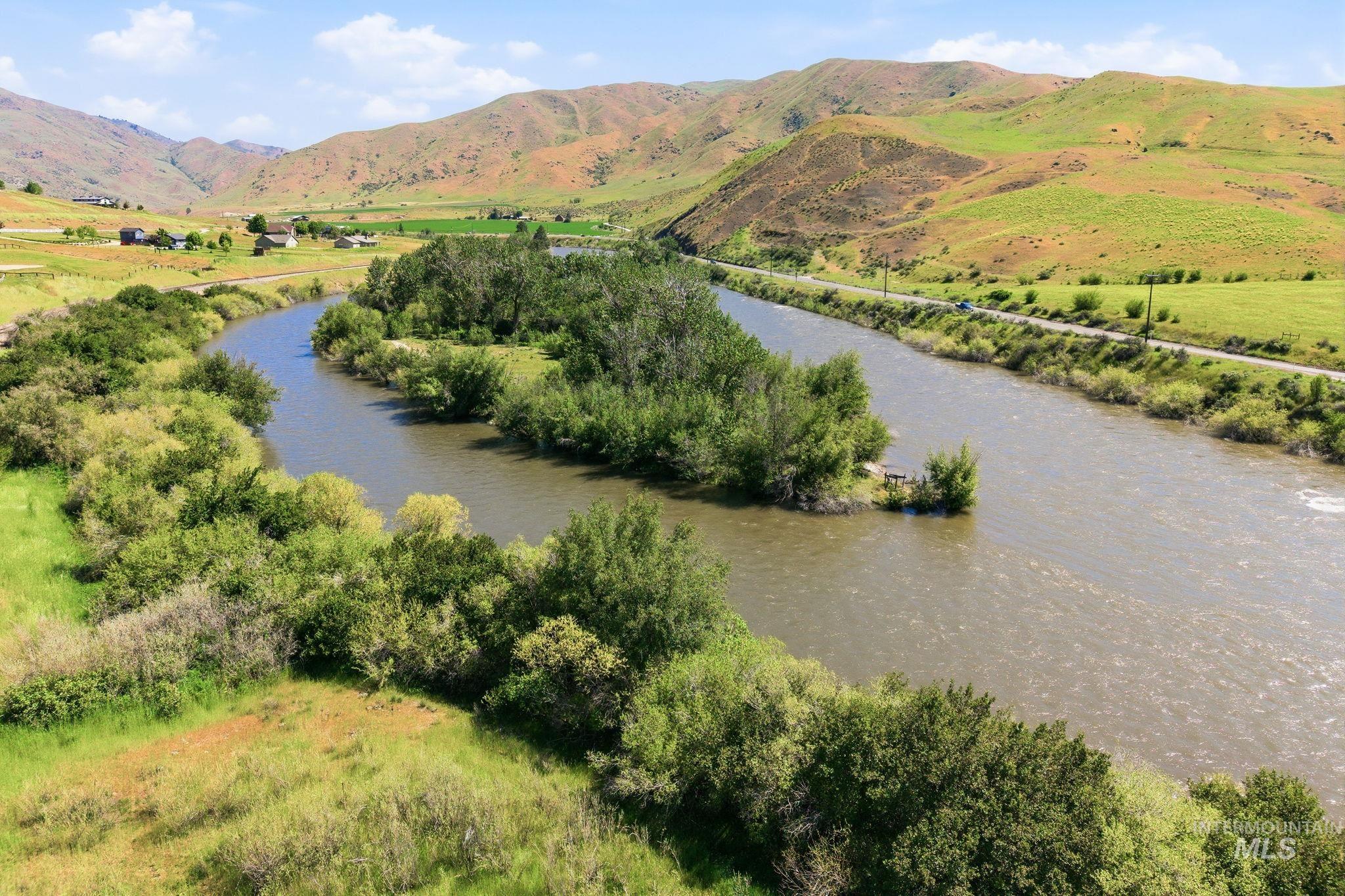 25 River Ridge Horseshoe Bend, ID 83629 - Photo 6 of 50 Serene river landscape featuring verdant hillsides, a winding waterway, and mature trees