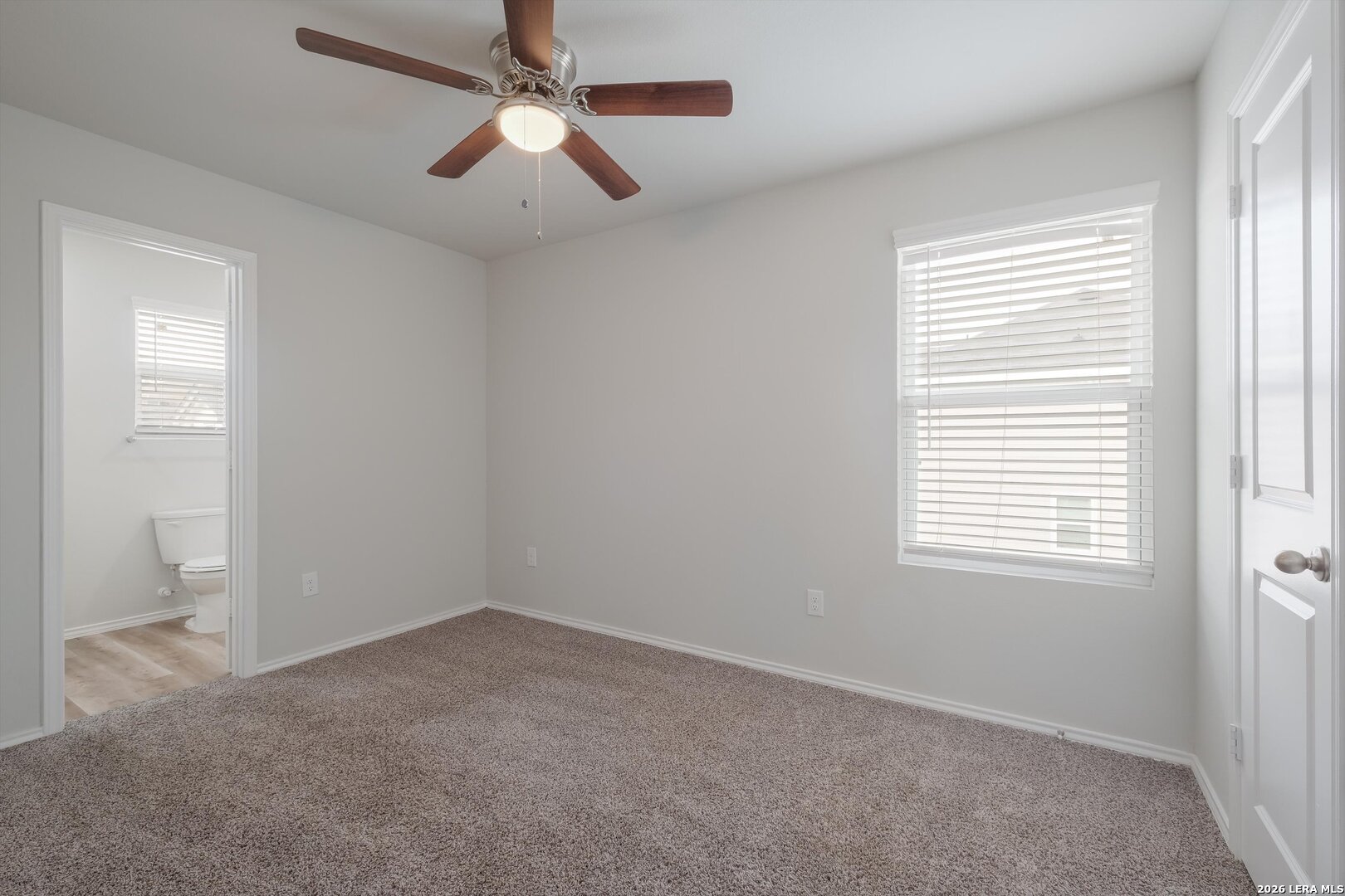 7356 Misty Ridge Drive, Unit 101 Converse, TX 78109 - Photo 11 of 18 a view of an empty room with a window