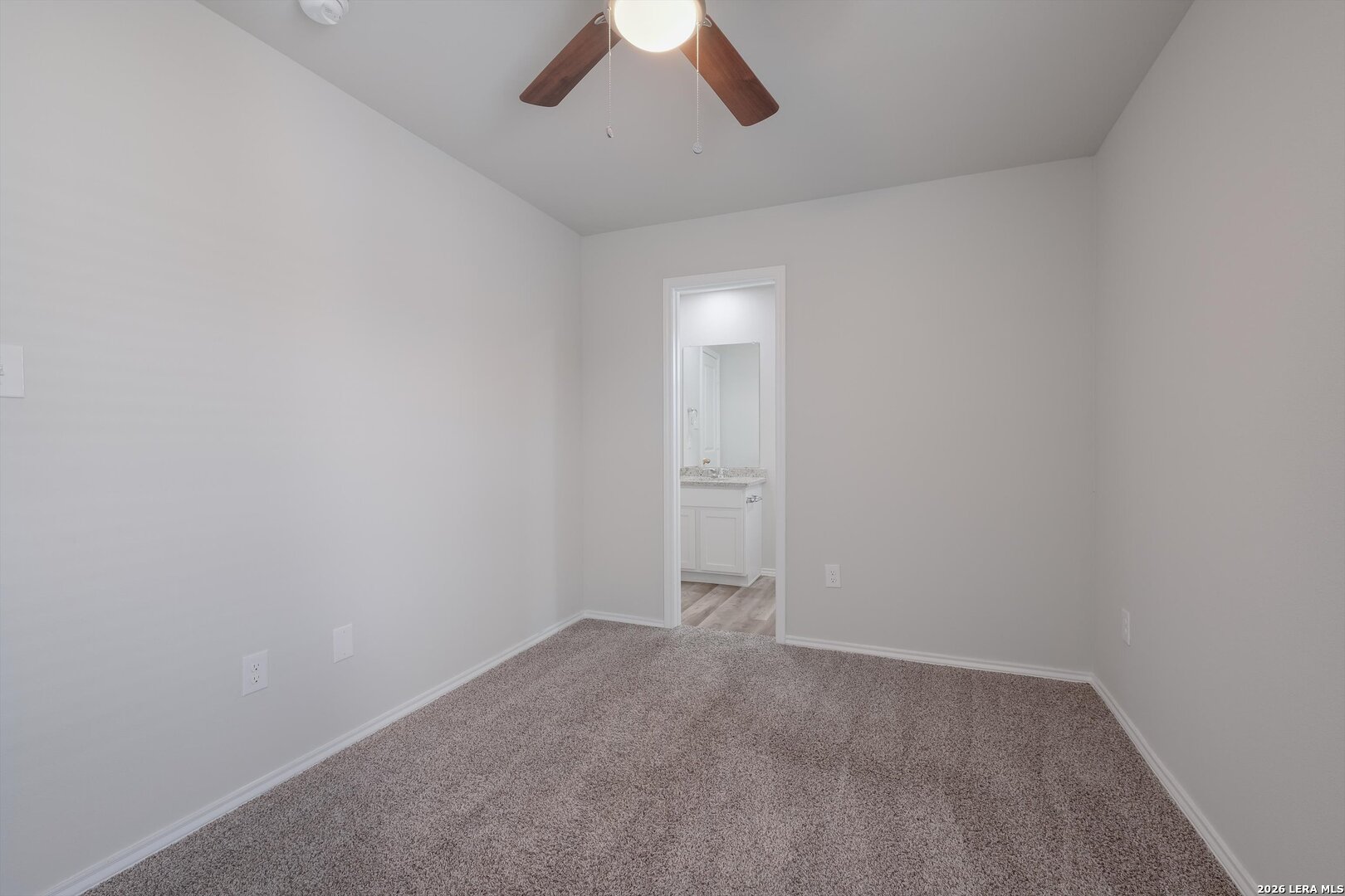 7356 Misty Ridge Drive, Unit 101 Converse, TX 78109 - Photo 12 of 18 an empty room with a empty space and a ceiling fan