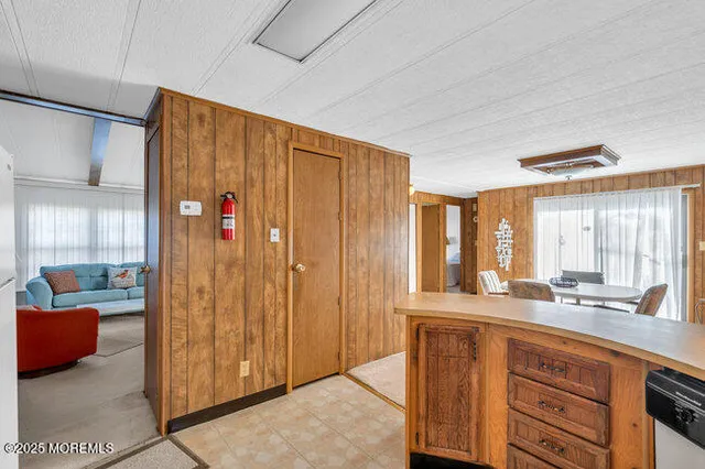 a bathroom with a double vanity sink and large mirror