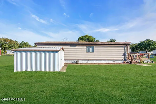 a view of a backyard with plants and a garden