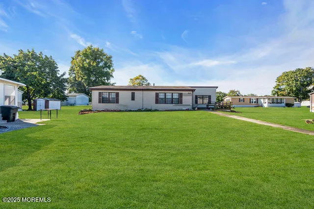 a view of a house with a big yard