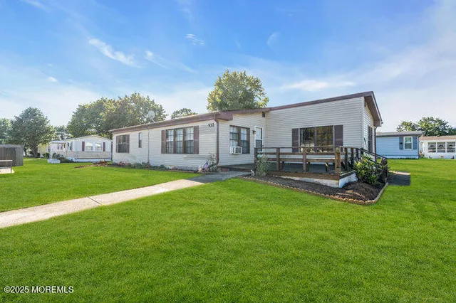 a view of an house with backyard porch and sitting area
