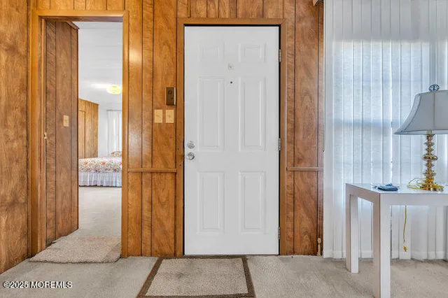a view of a hallway with windows