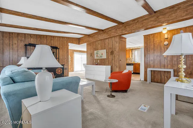 a living room with furniture and a lamp