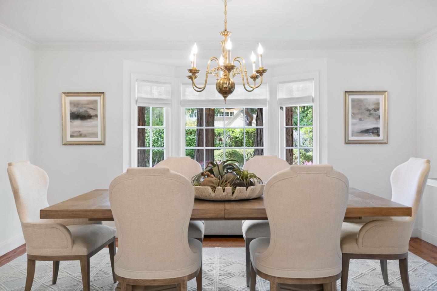 310 Ranelagh Road Hillsborough, CA 94010 - Photo 11 of 51 a dining room with furniture a large window and a chandelier