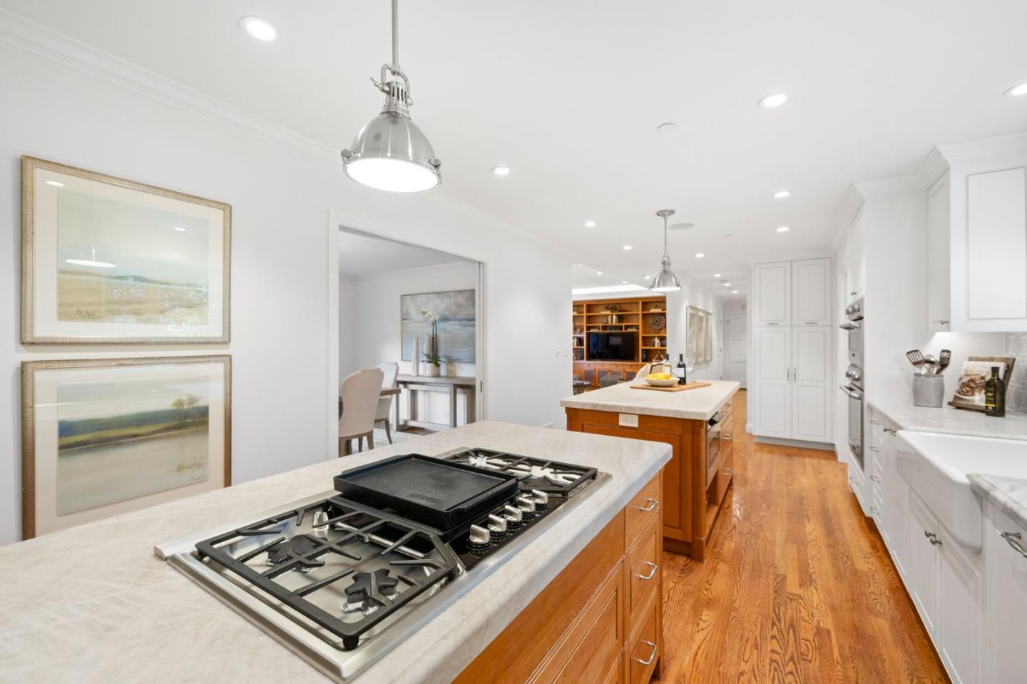310 Ranelagh Road Hillsborough, CA 94010 - Photo 15 of 51 a kitchen with stove and wooden floor