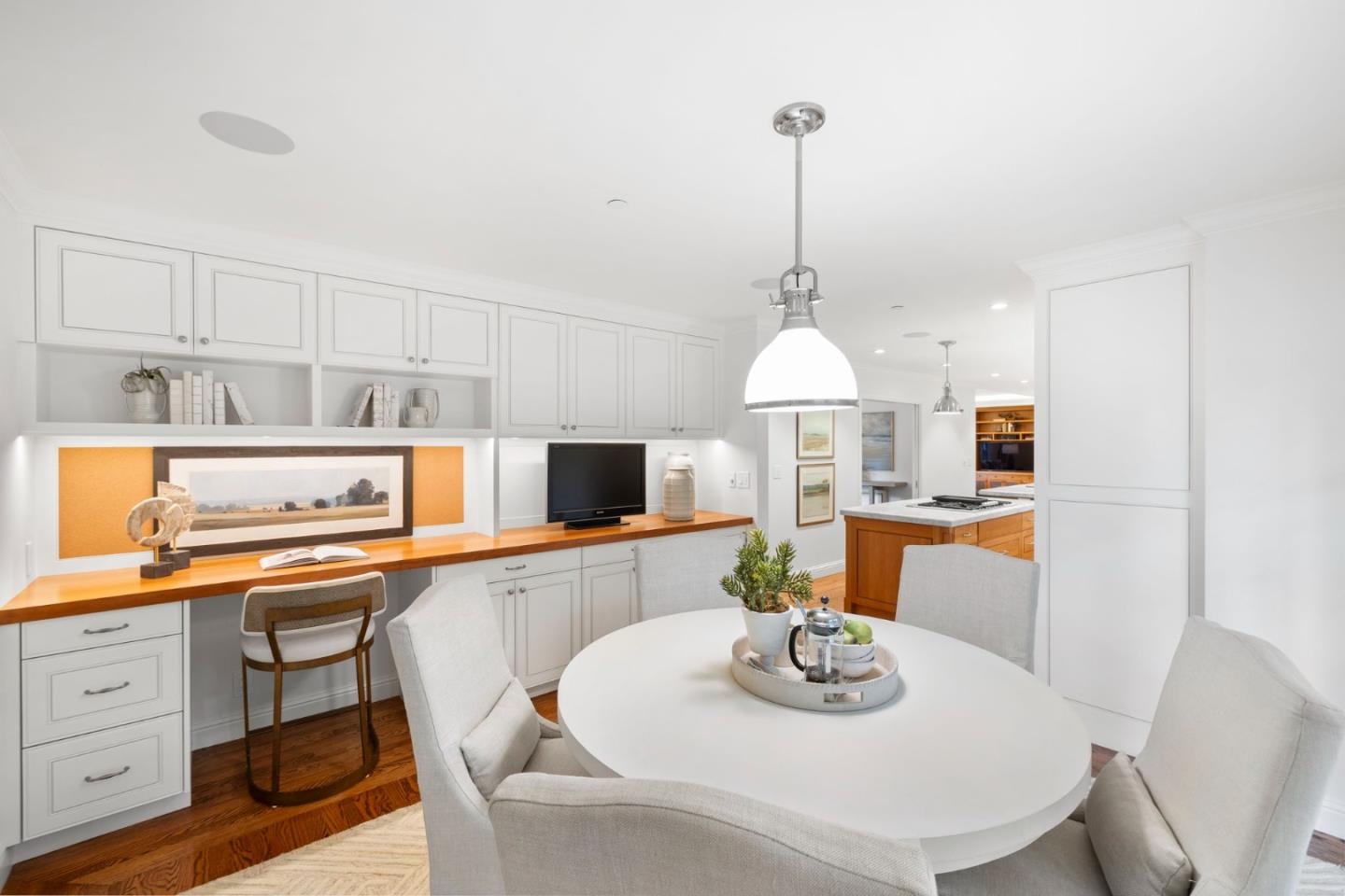 310 Ranelagh Road Hillsborough, CA 94010 - Photo 17 of 51 a dining room with furniture and a chandelier