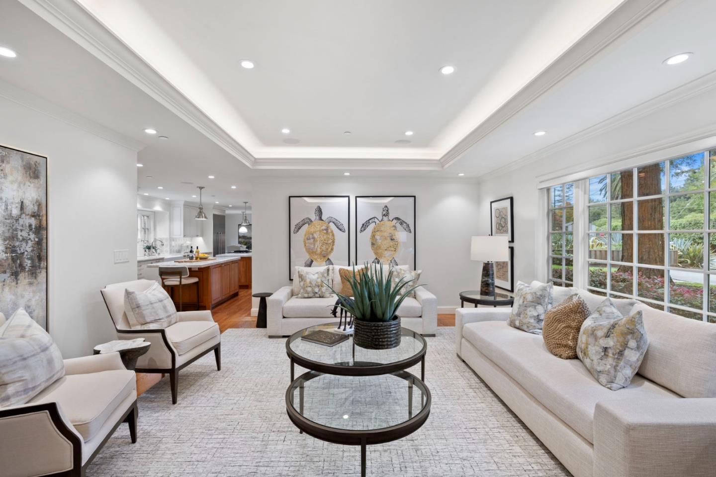 310 Ranelagh Road Hillsborough, CA 94010 - Photo 19 of 51 a living room with furniture potted plant and a large window