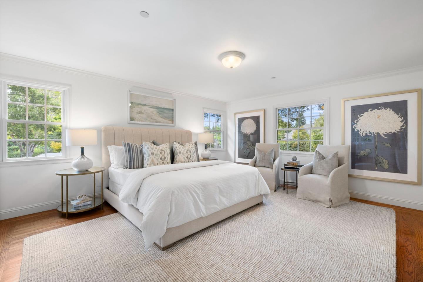 310 Ranelagh Road Hillsborough, CA 94010 - Photo 22 of 51 a spacious bedroom with a bed and a couch