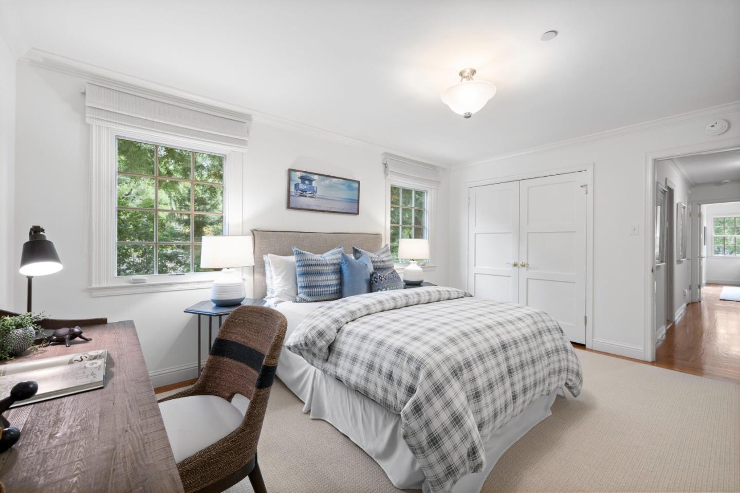 310 Ranelagh Road Hillsborough, CA 94010 - Photo 31 of 51 a bedroom with a bed and a table with chair